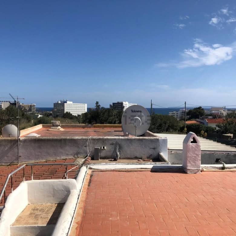 Villa estate of 2 houses for sale in Playa Den Bossa, Ibiza, offering stunning sea views and modern.