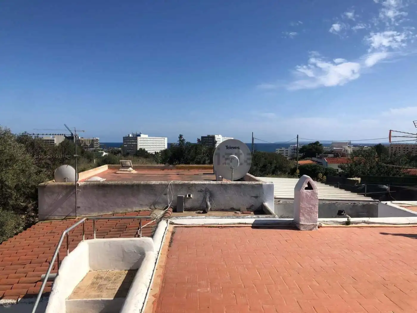 Villa estate of 2 houses for sale in Playa Den Bossa, Ibiza, offering stunning sea views and modern.