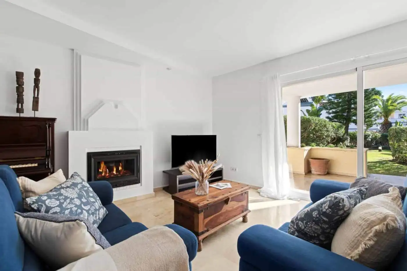 Beachfront living room with ocean views and modern decor.