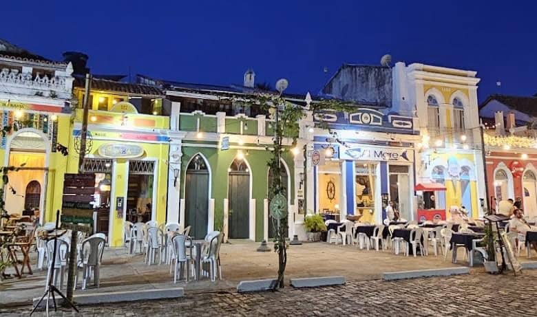 Colorful colonial houses in Canavieiras, Bahia, Brazil illuminated at night.