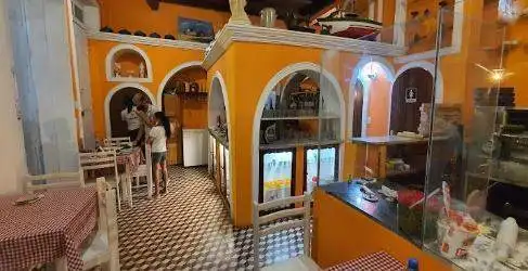 Interior view of a vibrant Mexican restaurant with colorful decor and traditional furnishings.