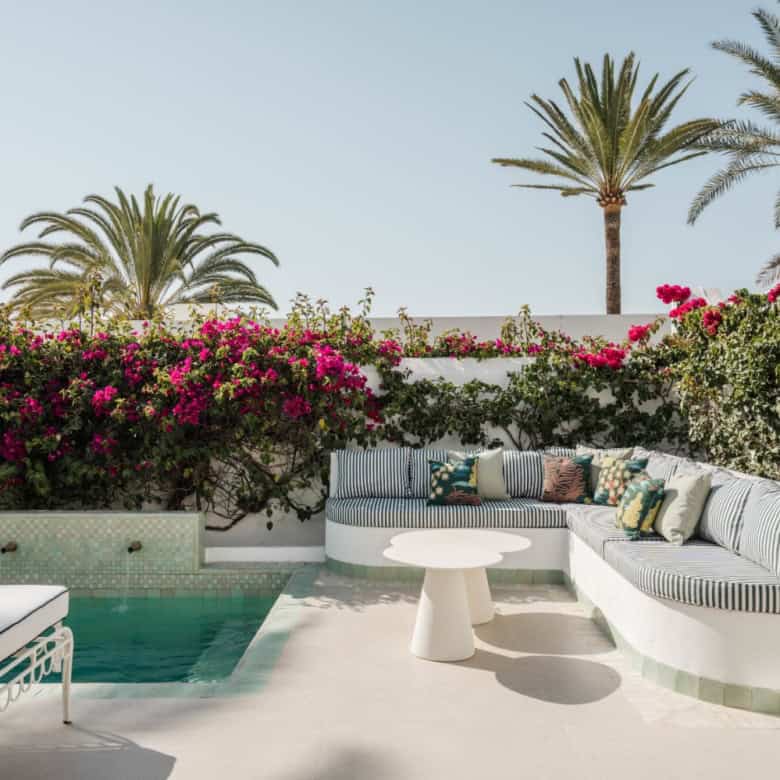 Beachfront semi-detached home in Marbella Golden Mile with lush gardens and pool. Perfect for a luxu.