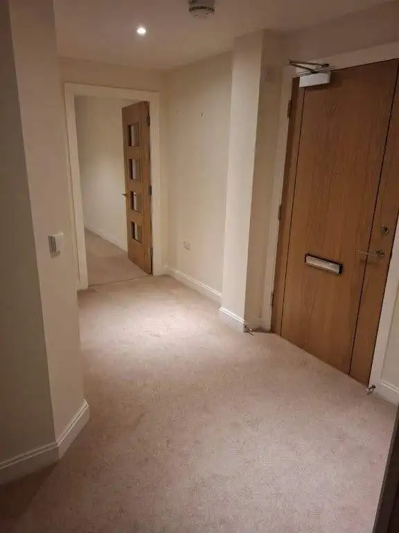 Spacious entrance hall of a 2-bedroom apartment at Coppice Gate, Dibden Purlieu, Hampshire, UK.