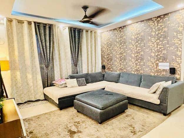 Modern living room with elegant decor and comfortable seating.