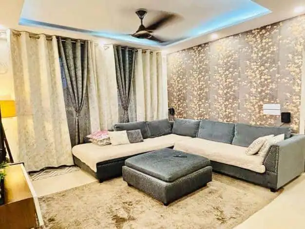 Modern living room with elegant decor and comfortable seating.