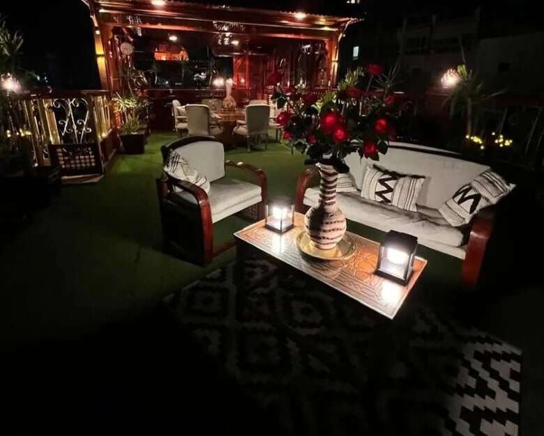 Outdoor lounge with cozy seating and ambient lighting in Derrymore Glen Estate.