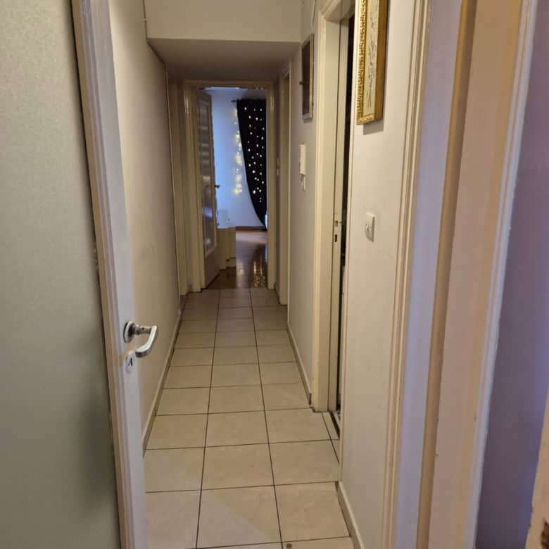 Spacious 3-bedroom apartment for sale in Kypseli, Athens, featuring balconies and a bright, welcomin.