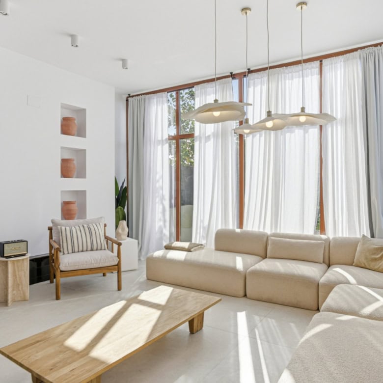 Bright and airy living room in a stylish corner townhouse in Cancelada, Estepona. Spacious area with.