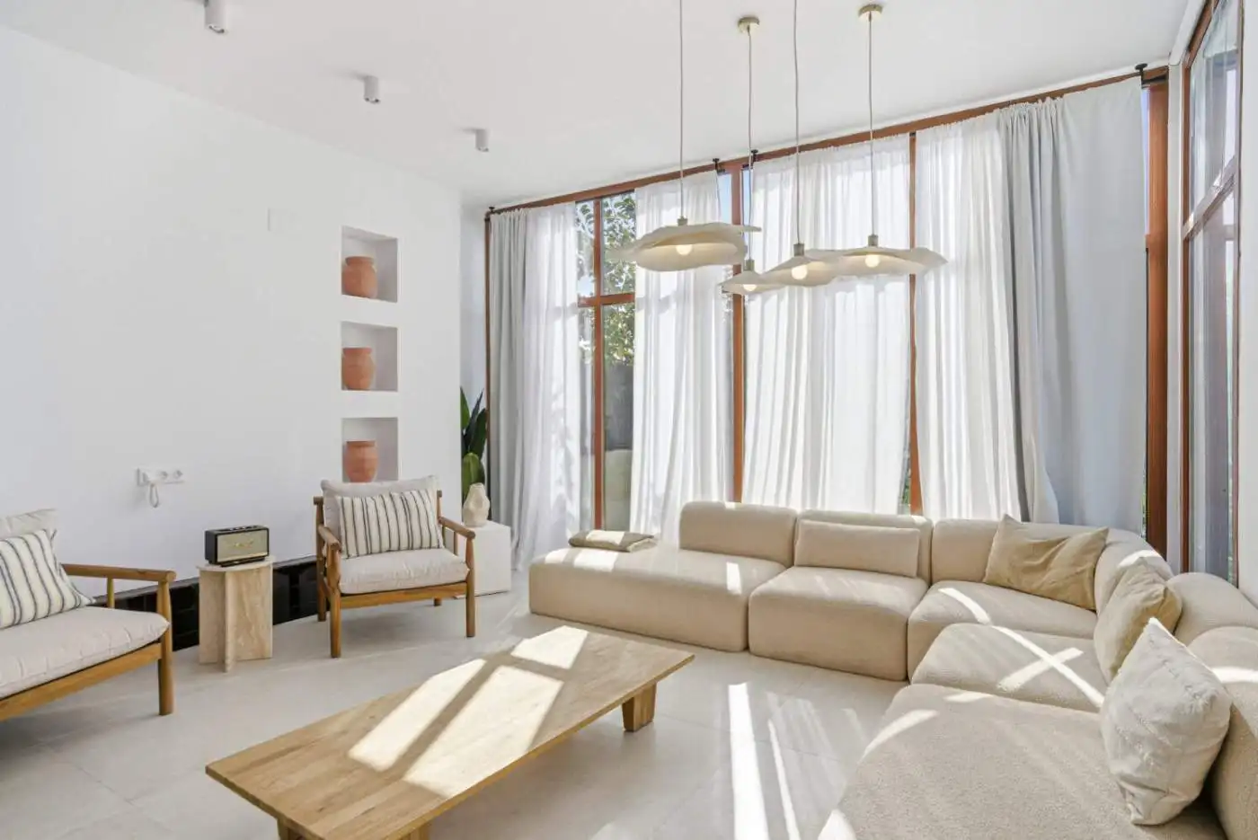 Bright and airy living room in a stylish corner townhouse in Cancelada, Estepona. Spacious area with.