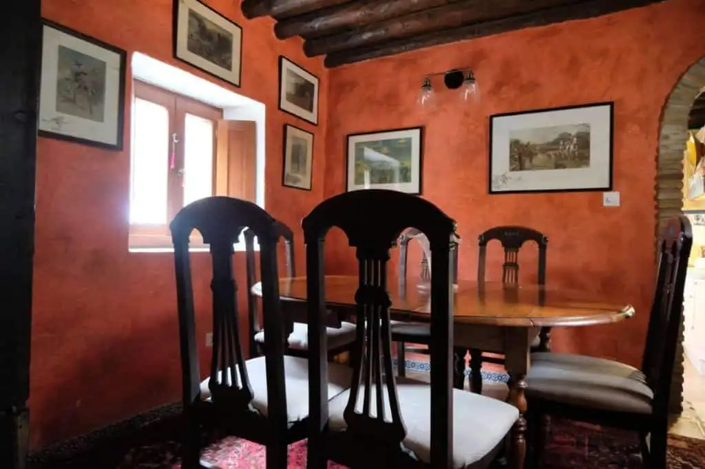 Cozy dining area in a traditional Spanish finca with wooden beams and rustic decor in Estepona, Spai.