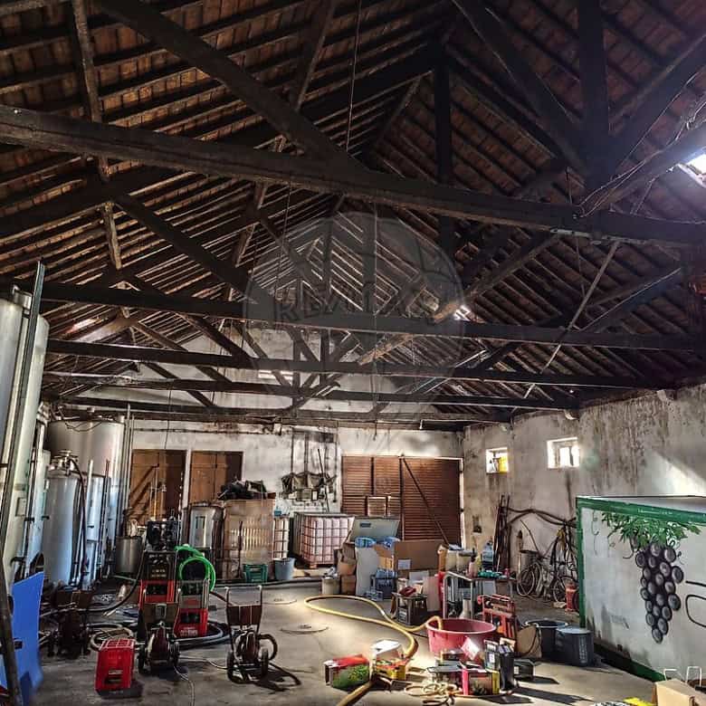 Interior of a rustic barn with land and equipment in Cabanas Setubal, Portugal.