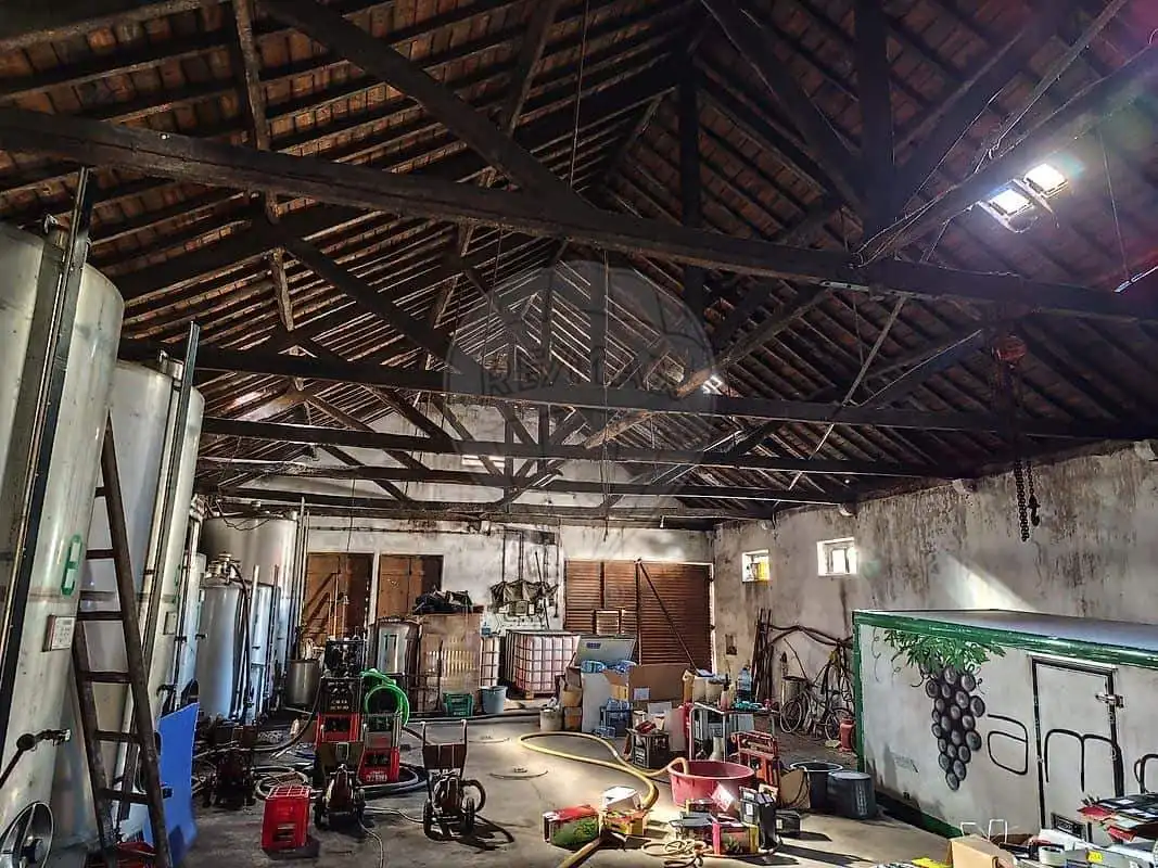 Interior of a rustic barn with land and equipment in Cabanas Setubal, Portugal.