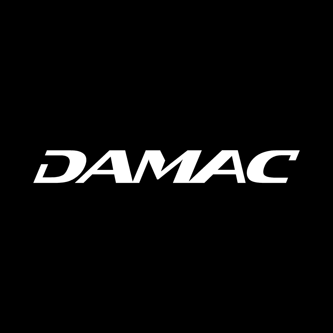 Damac logo on black background Damac logo on black background, luxury property developer branding.