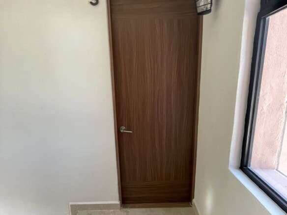 Modern interior door in a stylish rooftop home in San Miguel de Allende.