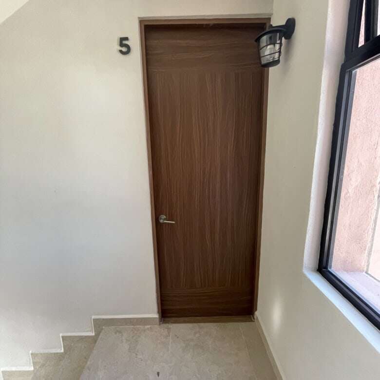 Modern interior door in a stylish rooftop home in San Miguel de Allende.