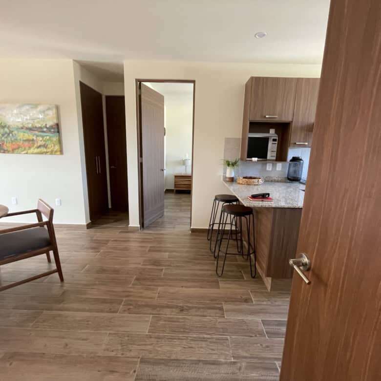 Bright interior of a 2-bedroom rooftop home in San Miguel de Allende, featuring modern kitchen and c.