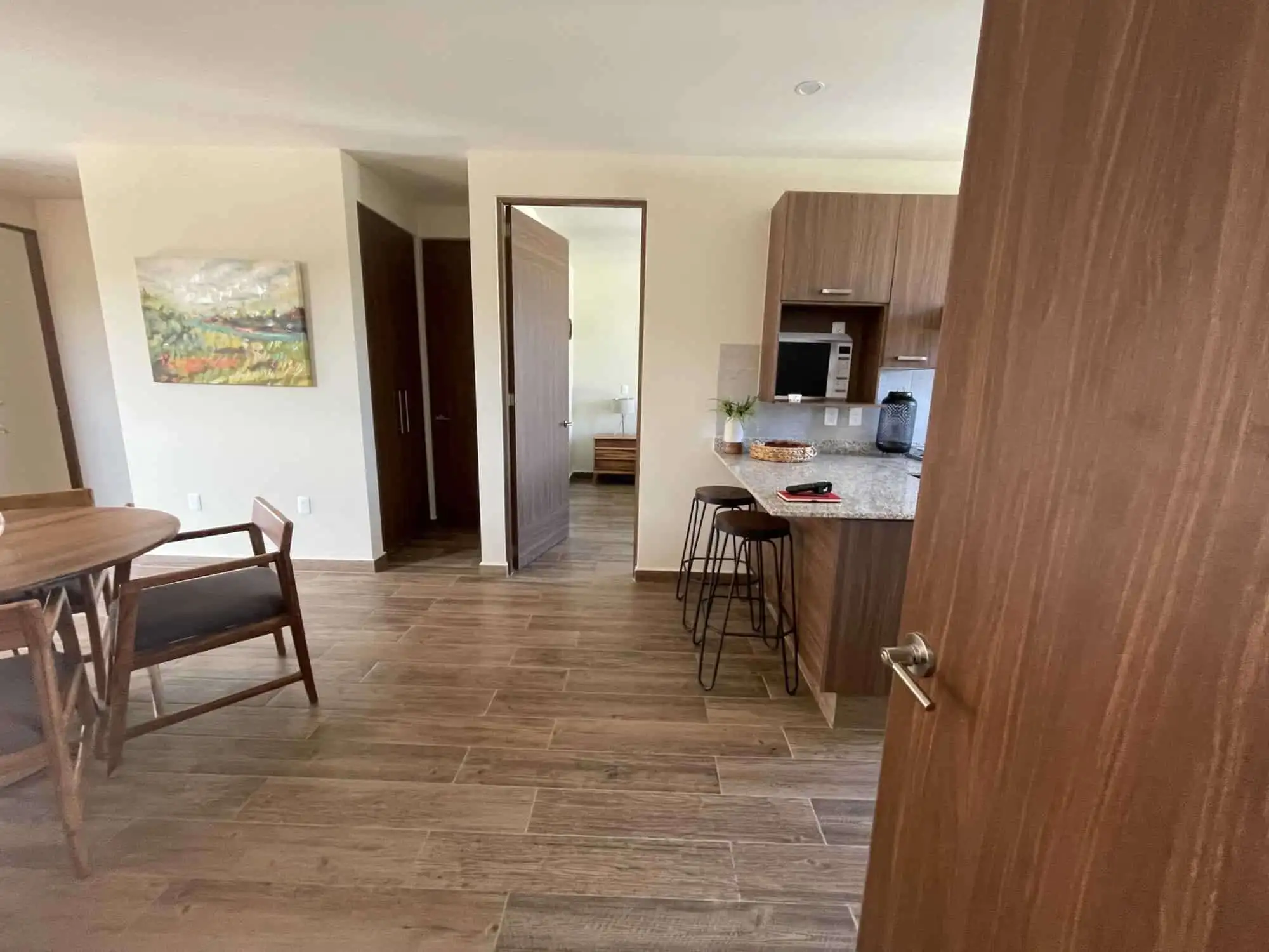 Bright interior of a 2-bedroom rooftop home in San Miguel de Allende, featuring modern kitchen and c.