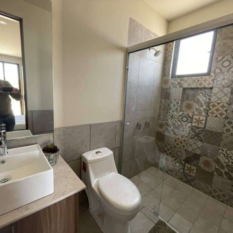 Contemporary bathroom with walk-in shower and stylish tile design in San Miguel de Allende.