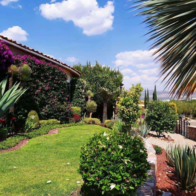 Elegant outdoor living space in Rancho Los Labradores, San Miguel de Allende. Beautiful garden, lush.
