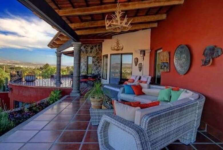 Outdoor terrace with comfortable seating and scenic landscape views.