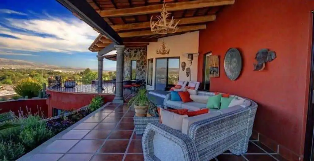 Outdoor terrace with comfortable seating and scenic landscape views.