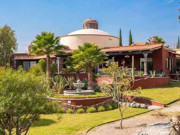 Style villa surrounded by lush gardens and a swimming pool. Perfect for a serene lifestyle and inves.