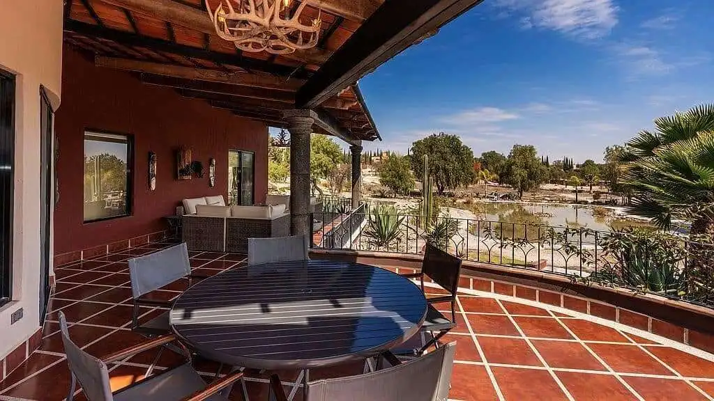 Outdoor terrace with river view and seating area for relaxation.