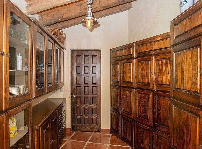 Spacious wooden storage room with cabinetry in a lakeside estate in Rancho Los Labradores.