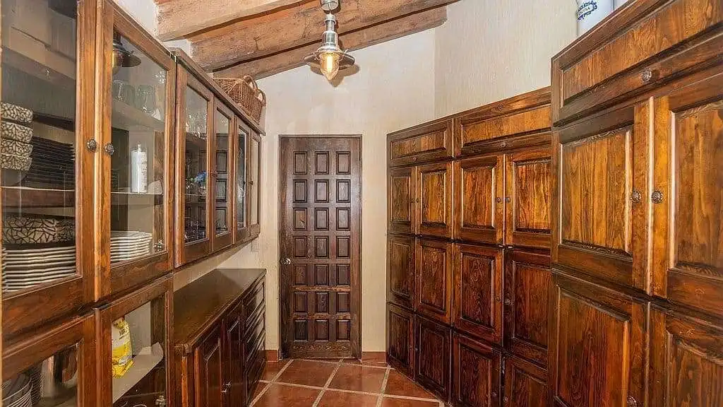 Spacious wooden storage room with cabinetry in a lakeside estate in Rancho Los Labradores.