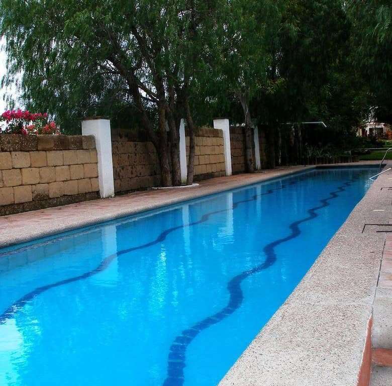 Lakeside swimming pool at luxury estate in Rancho Los Labradores, San Miguel de Allende.