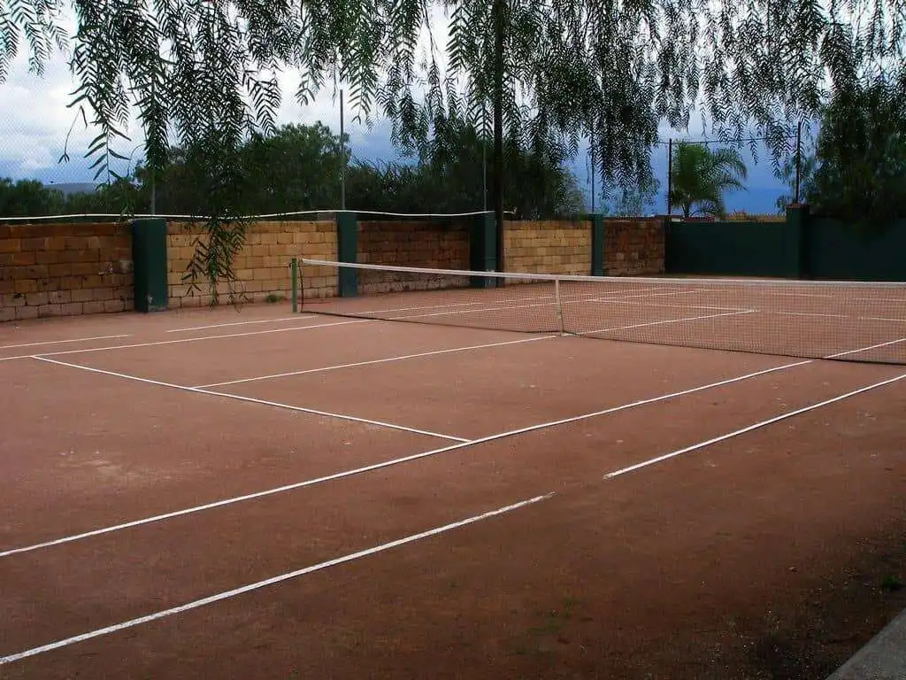Lakeside tennis court at Rancho Los Labradores estate in San Miguel de Allende.