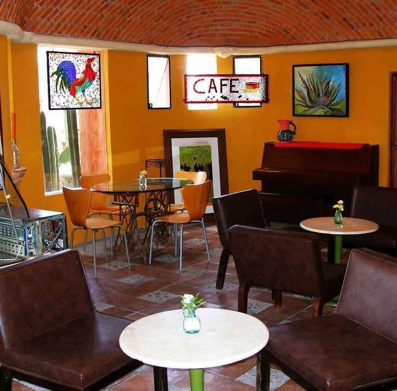 Charming interior of a lakeside estate with cozy seating and vibrant decor in Rancho Los Labradores.