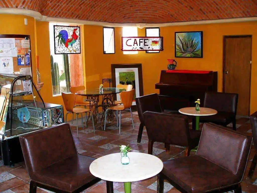 Charming interior of a lakeside estate with cozy seating and vibrant decor in Rancho Los Labradores.