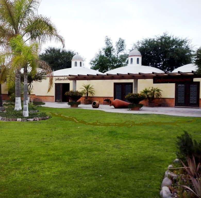 Elegant lakeside estate with lush gardens and spacious outdoor areas in Rancho Los Labradores.