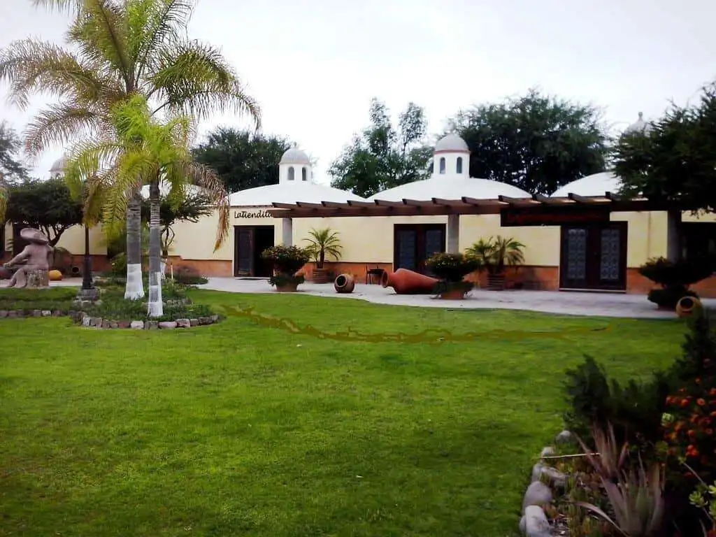 Elegant lakeside estate with lush gardens and spacious outdoor areas in Rancho Los Labradores.