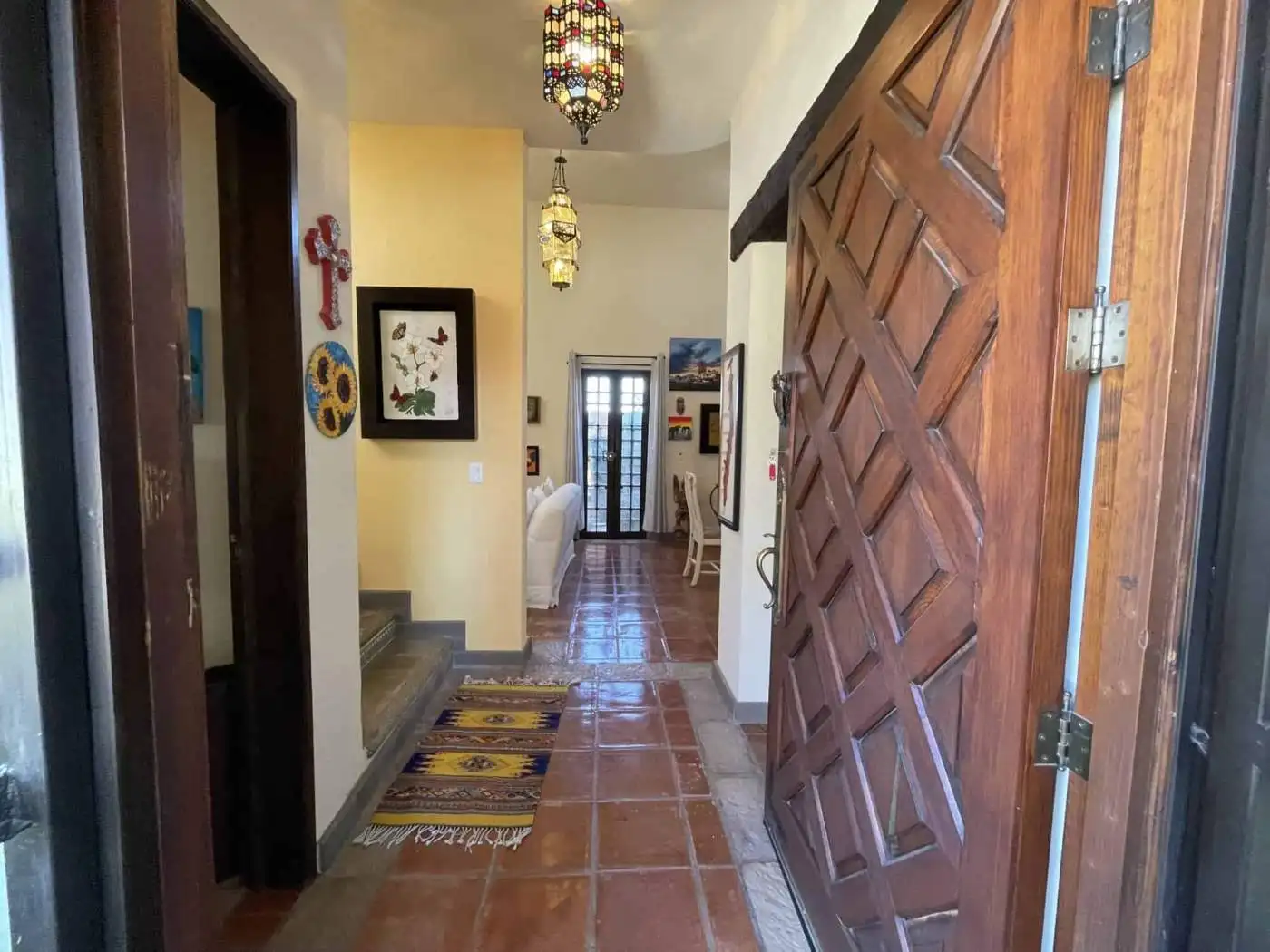 Beautiful Moroccan-inspired interior entrance with colorful decor and traditional lighting.