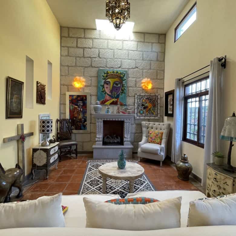 Bright living room with colorful artwork and unique decor elements.