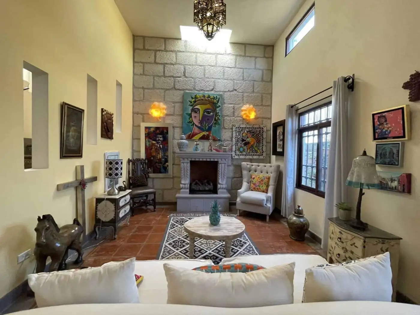 Bright living room with colorful artwork and unique decor elements.
