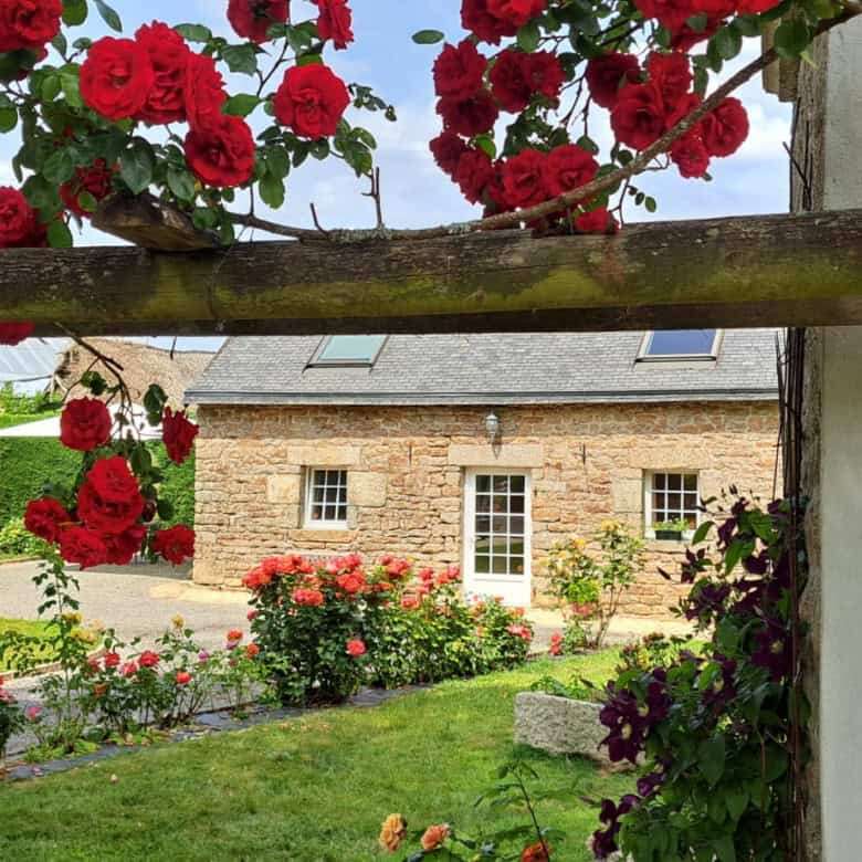 Elegant estate with lush gardens and vibrant roses in Brittany. Perfect for luxury living and invest.