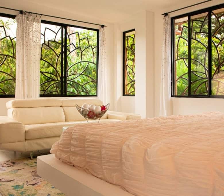 View bedroom with large windows and natural light.