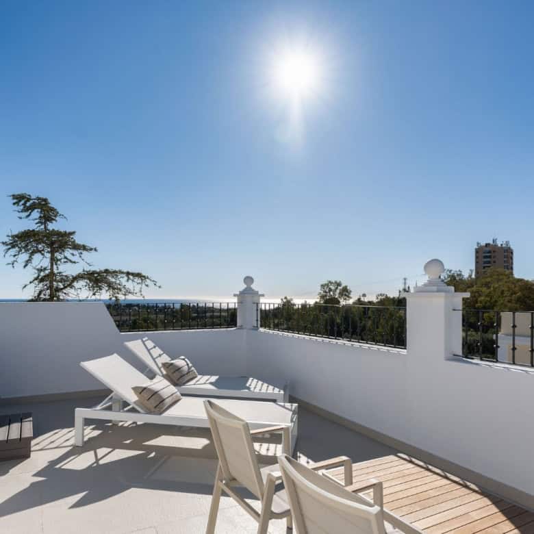 Panoramic view from Aloha Gardens duplex penthouse with outdoor terrace and cityscape.