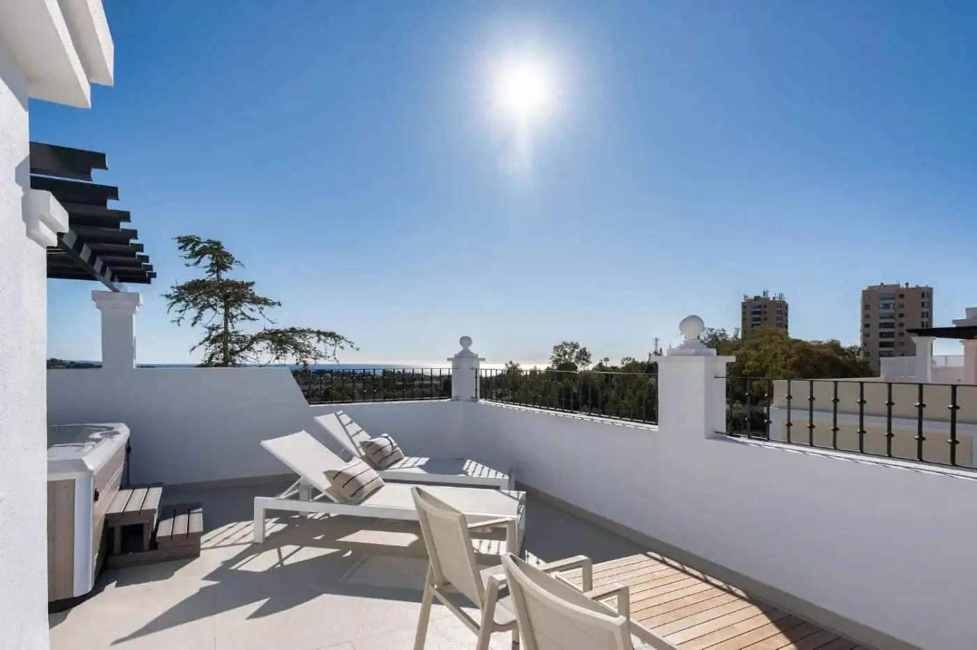 Panoramic view from Aloha Gardens duplex penthouse with outdoor terrace and cityscape.