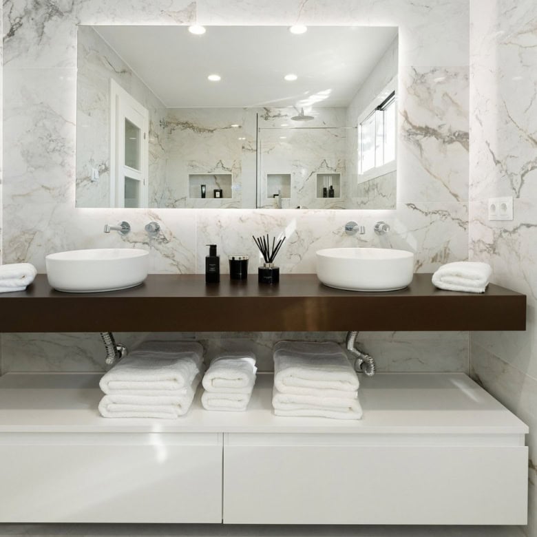 Luxurious duplex penthouse bathroom with modern design and panoramic city views.