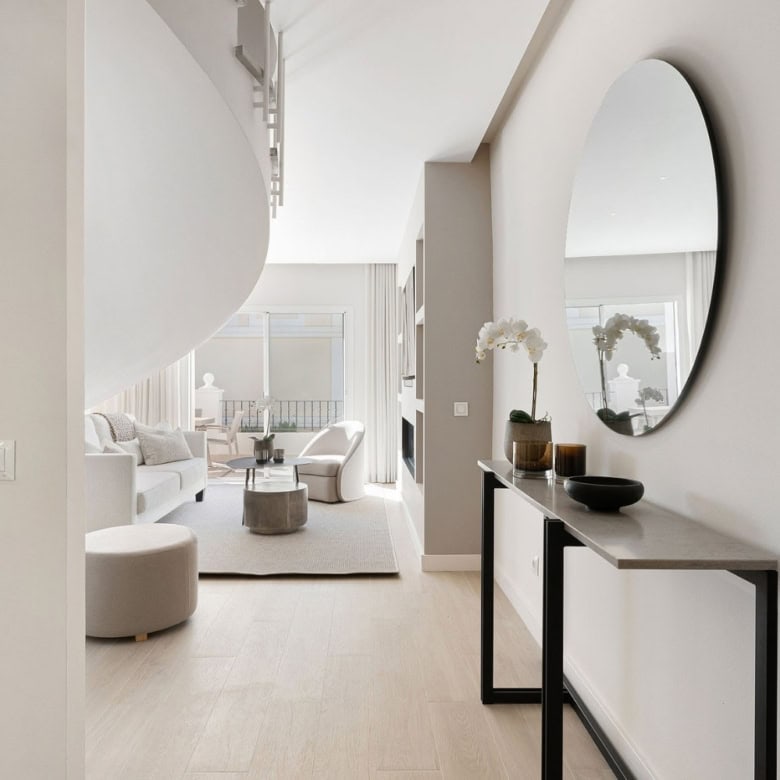 Elegant duplex penthouse living room with modern decor and panoramic views.