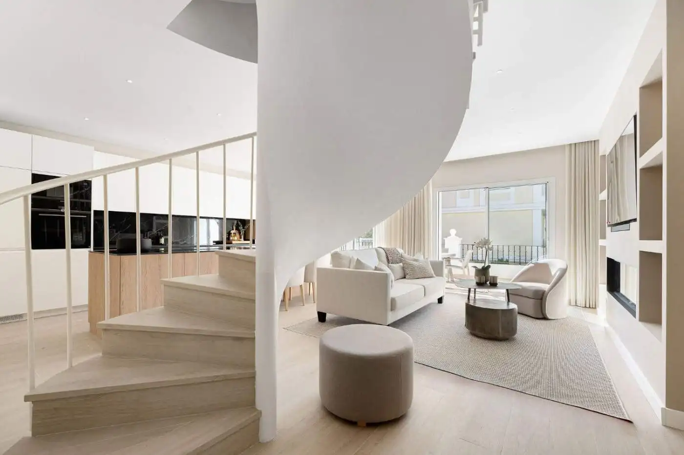 Spacious living area in Aloha Gardens duplex penthouse with large windows and elegant furniture.