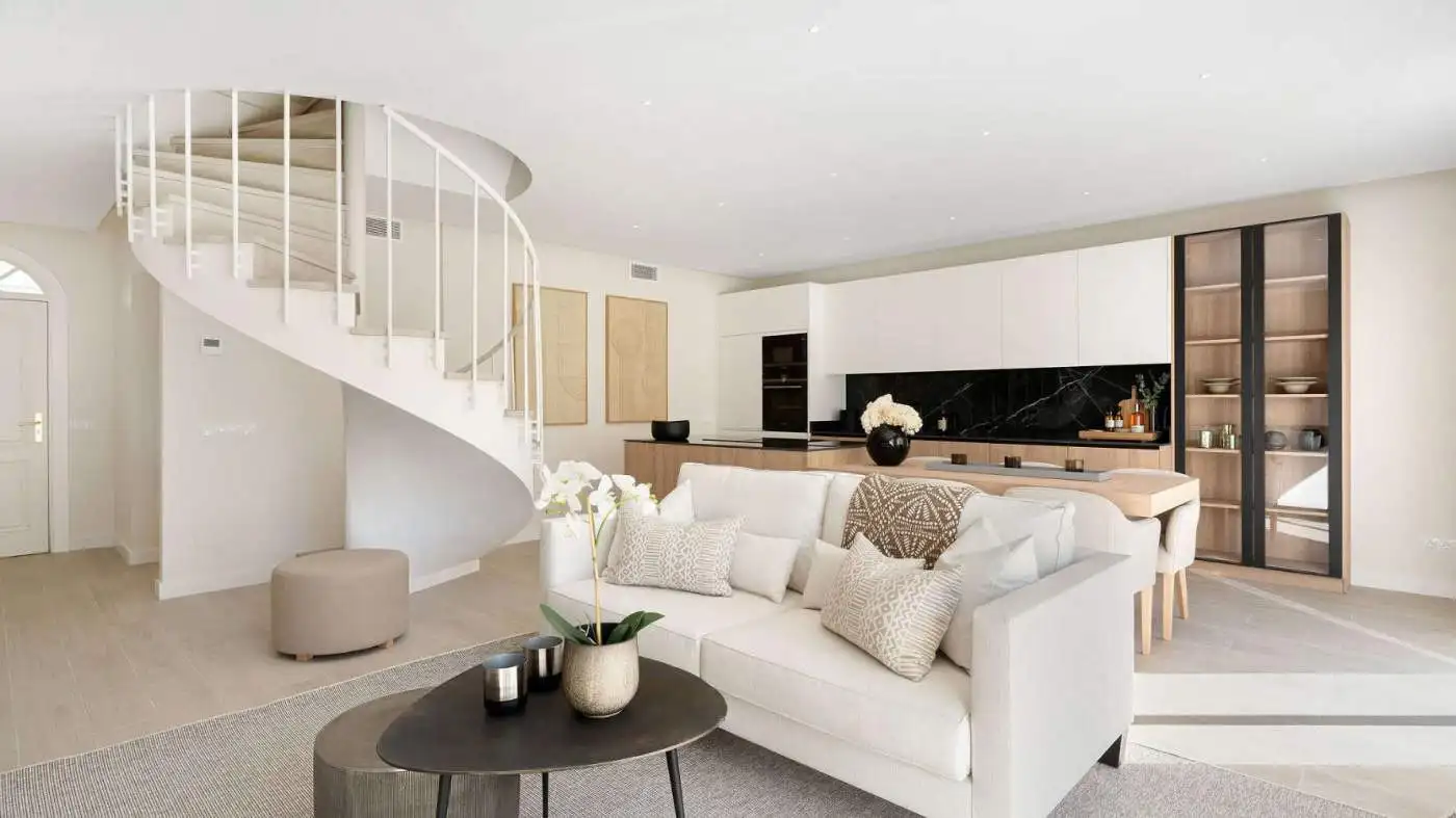 Elegant duplex penthouse living room with modern decor and open-plan design.