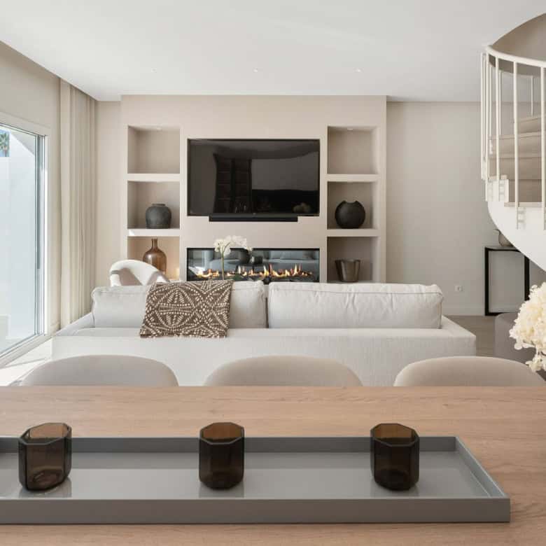 Modern duplex penthouse living room with panoramic views and stylish decor.