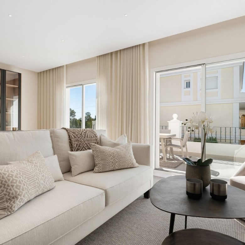 Elegant living room with large windows and balcony views.