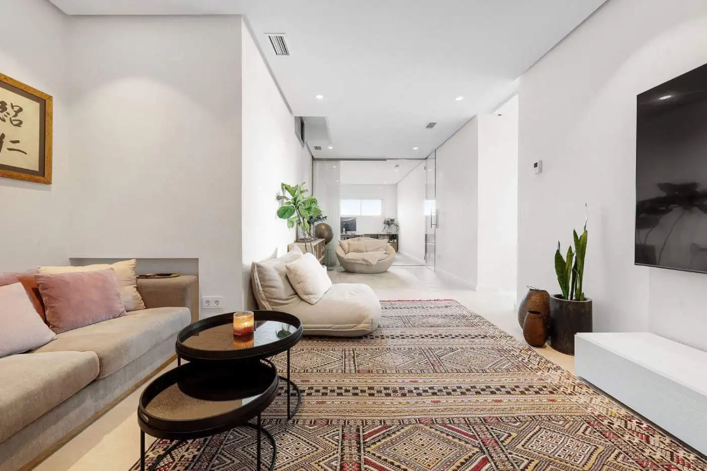 Spacious interior featuring comfortable sofas, stylish decor, and natural light.