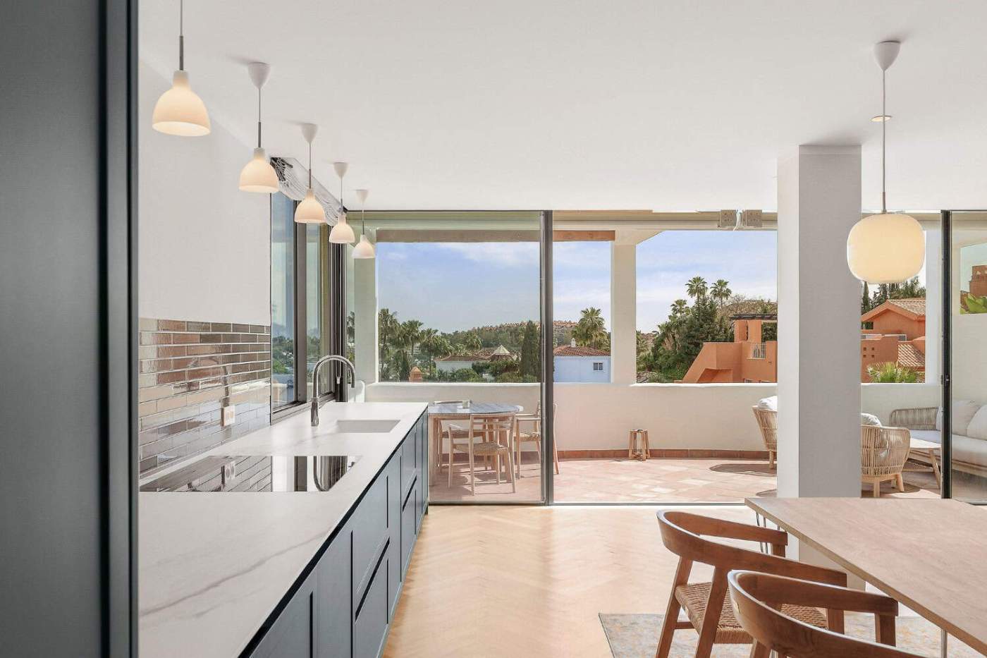 Spacious loft apartment featuring large windows and a balcony with panoramic views in Palacetes Les.